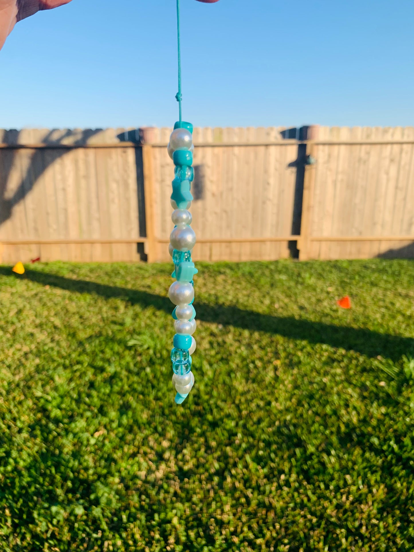 teal phone charm